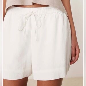 White linen drawstring shorts with pockets